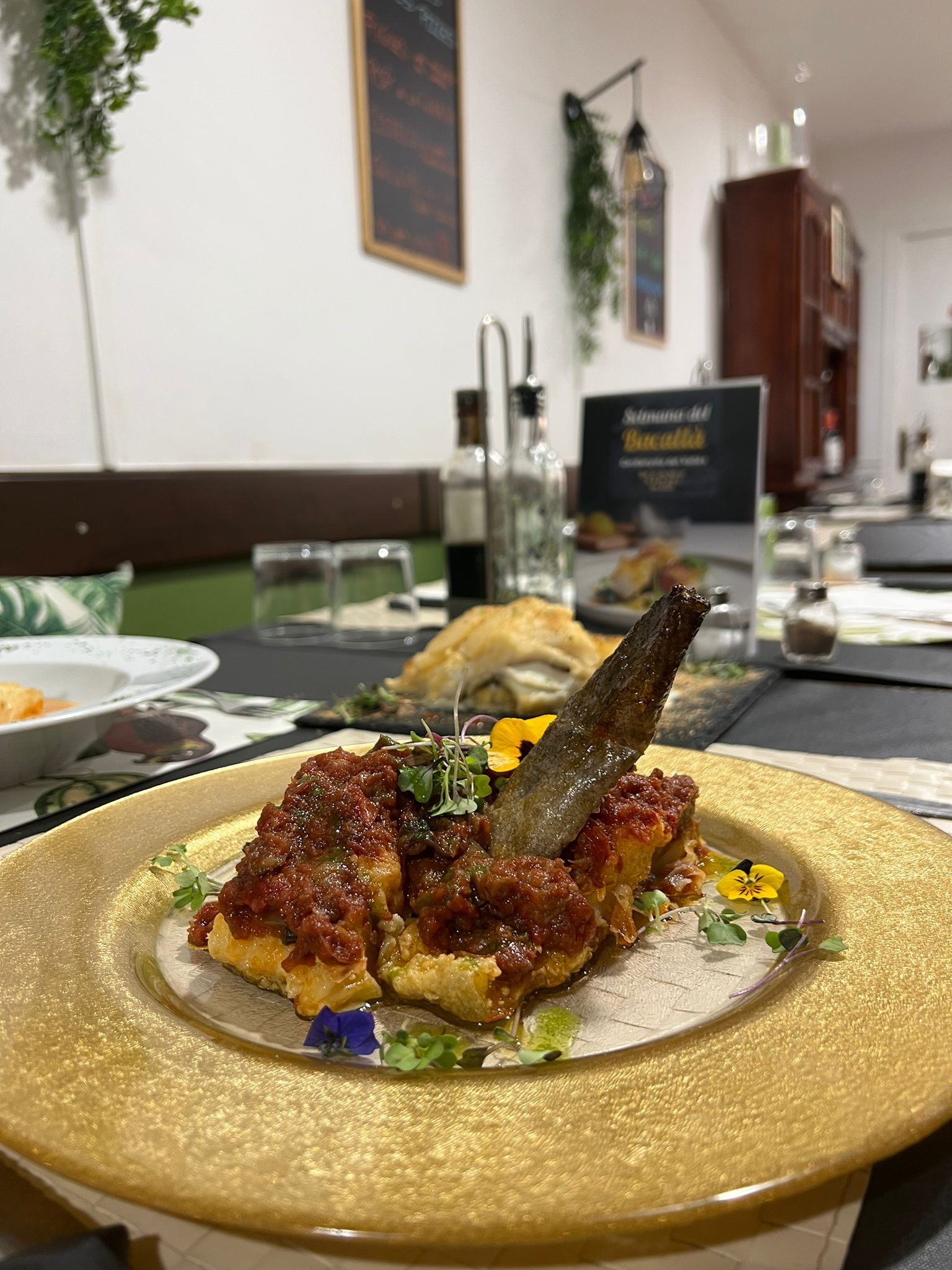 Plats de bacallà al restaurant El Racó de la Plaça. Foto: Laia Jubany